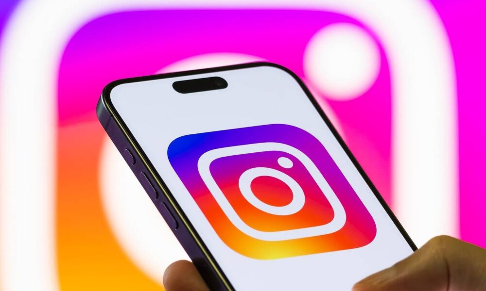 Instagram logo displayed on a smartphone.