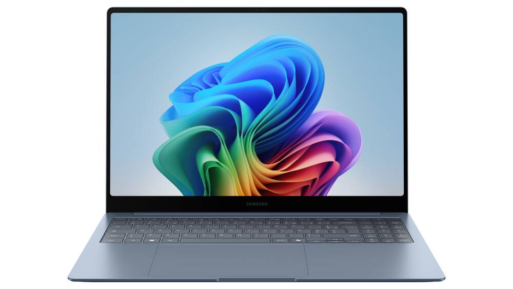 Dark gray Samsung laptop with a colorful abstract wallpaper.