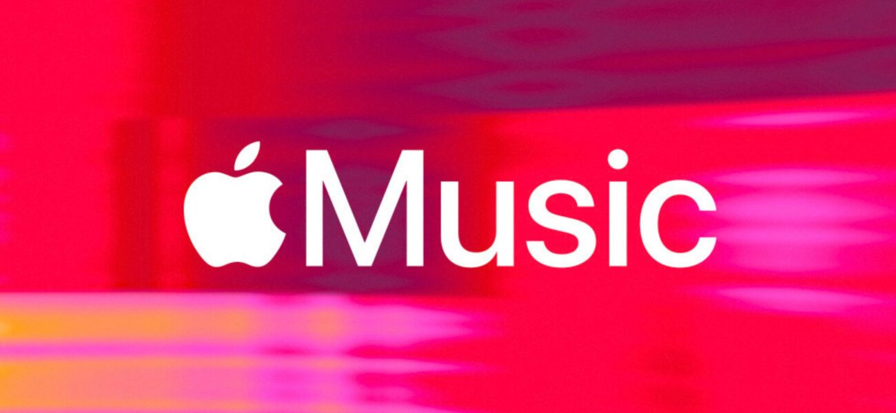 White Apple Music logo on an abstract red and pink background.